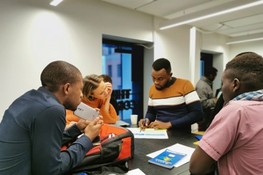 People sitting around desk