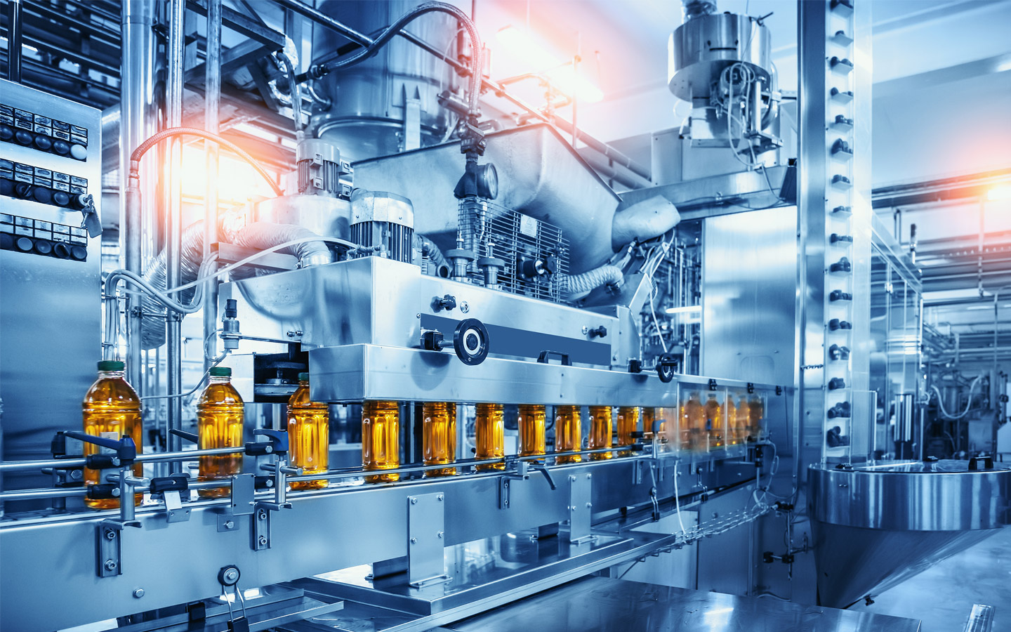 Automated beverage bottling production line in a modern industrial facility.
