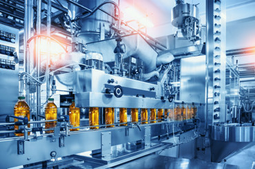 Automated beverage bottling production line in a modern industrial facility.