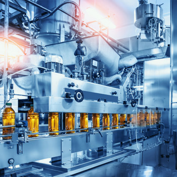 Automated beverage bottling production line in a modern industrial facility.